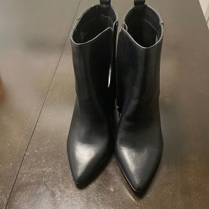 Black booties. Chunky heels with wide ankle area.